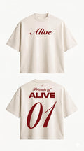 Beige t-shirt with 'Alive' text on front and back